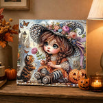 Finished little witch girl and kitten pearl diamond painting artwork displayed as holiday home decor
