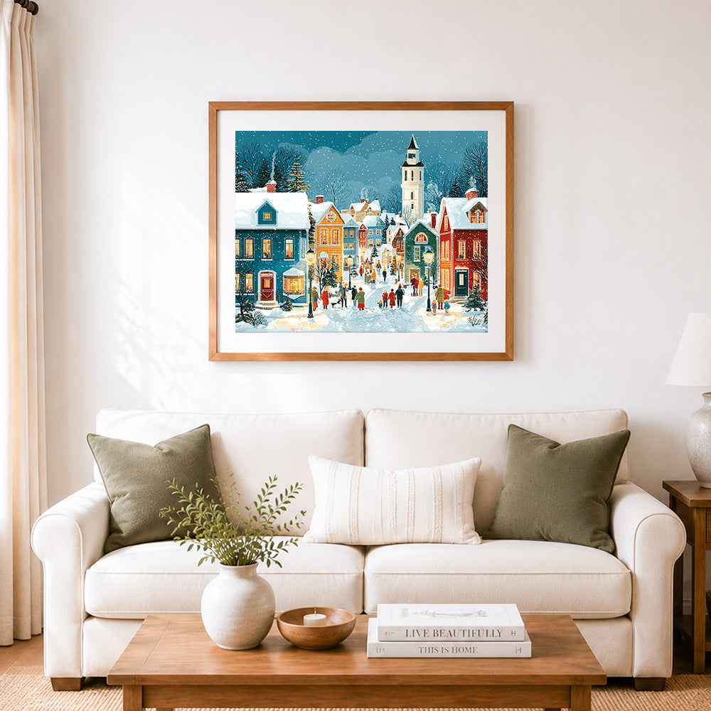 Finished lively snowy street with clock tower cross stitch artwork displayed as home decor