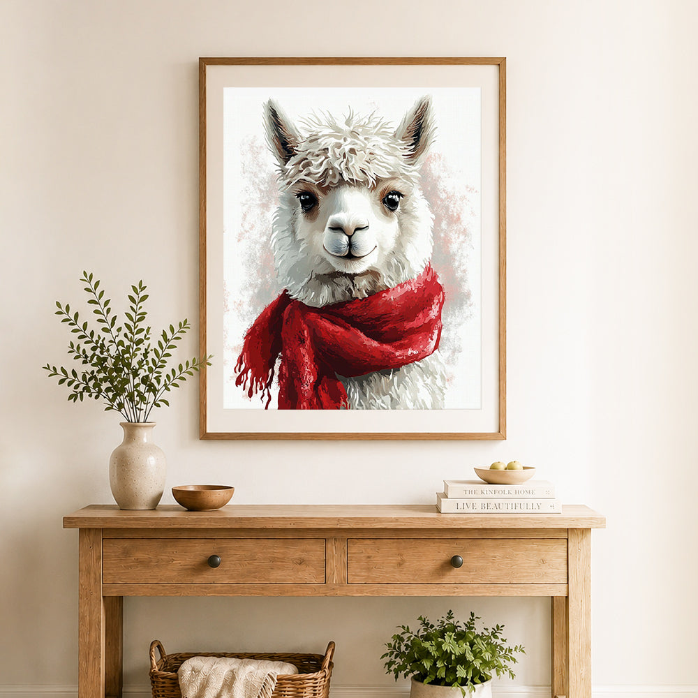 Finished llama with red scarf cross stitch artwork displayed as home decor