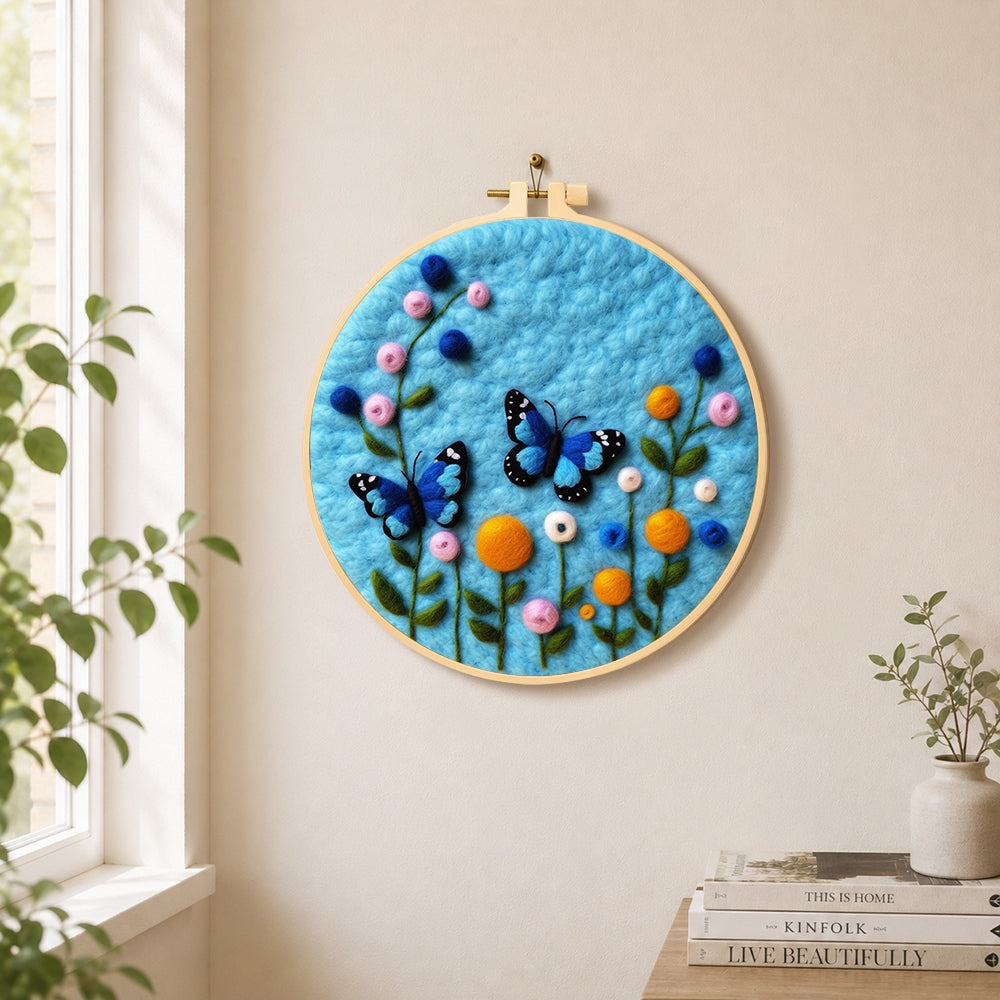 Lovely blue butterflies and flowers needle felt wall art displayed in a bright home interior