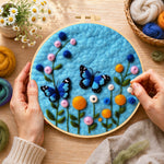 Creating the lovely blue butterflies and flowers wool painting by hand with a felting needle