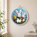 Lovely bunny pair with scarves needle felt wall art displayed in a bright home interior