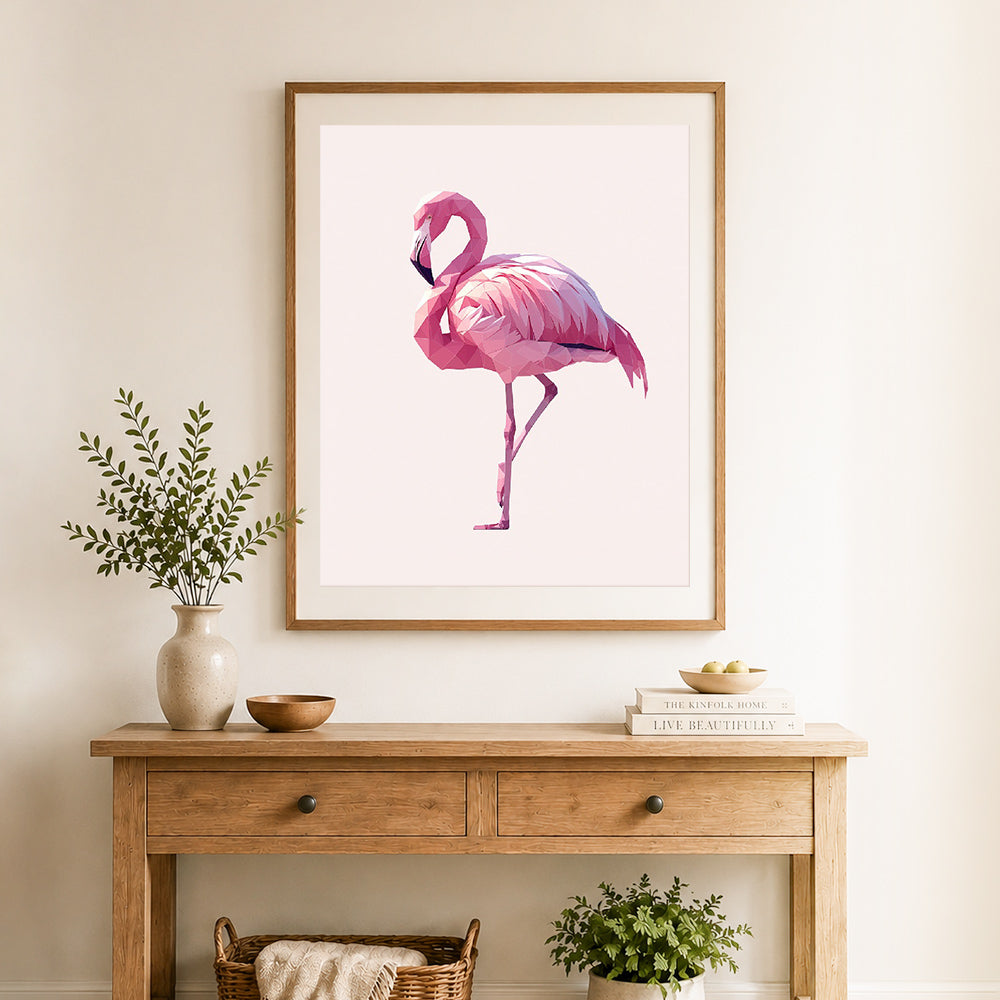 Finished low‑poly flamingo cross stitch artwork displayed as home decor