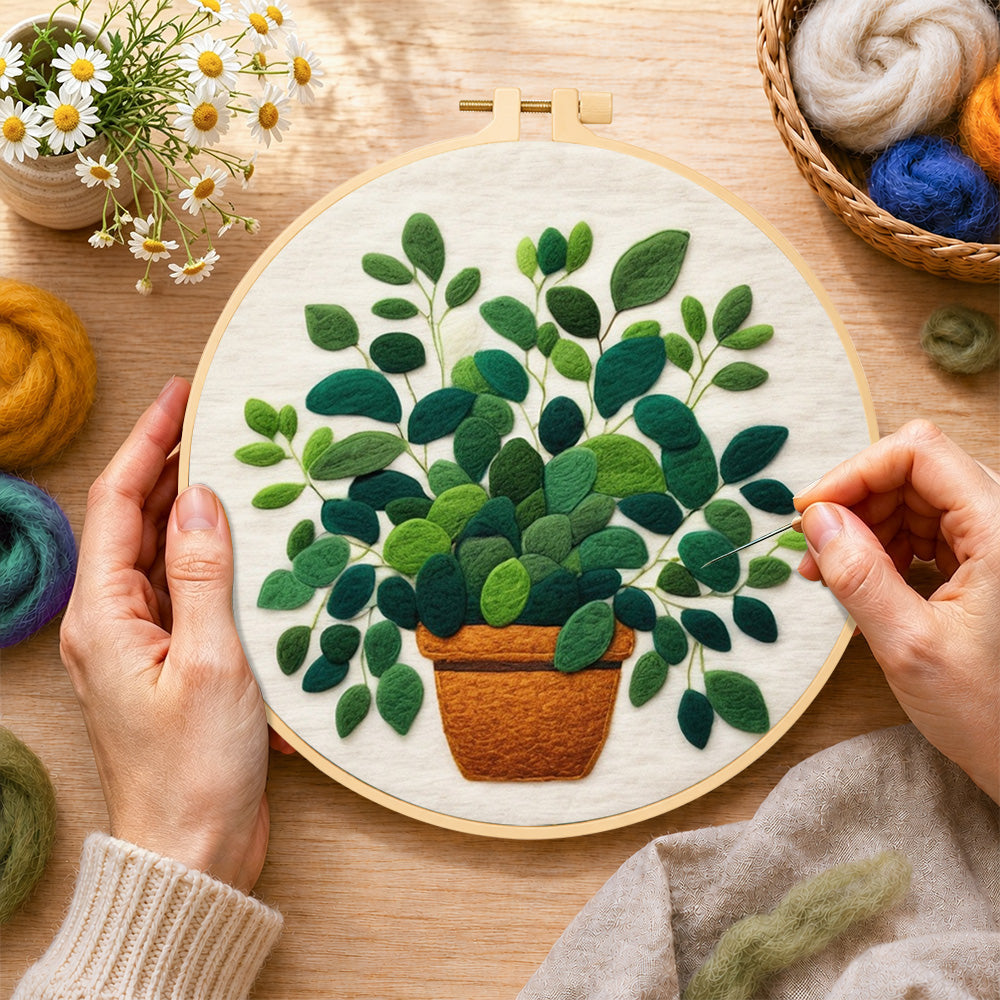 Creating the lush green potted plant wool painting by hand with a felting needle