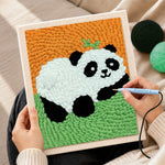 Creating handmade lying panda with bamboo punch needle artwork