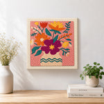 Finished magenta and orange bouquet artwork displayed on a wall