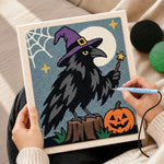 Creating handmade magic crow with witch hat punch needle artwork