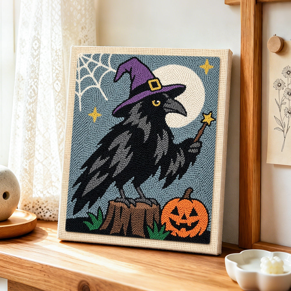 Magic crow with witch hat punch needle artwork displayed on a table