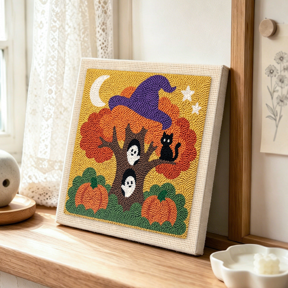 Magic halloween tree with ghosts punch needle artwork displayed on a table