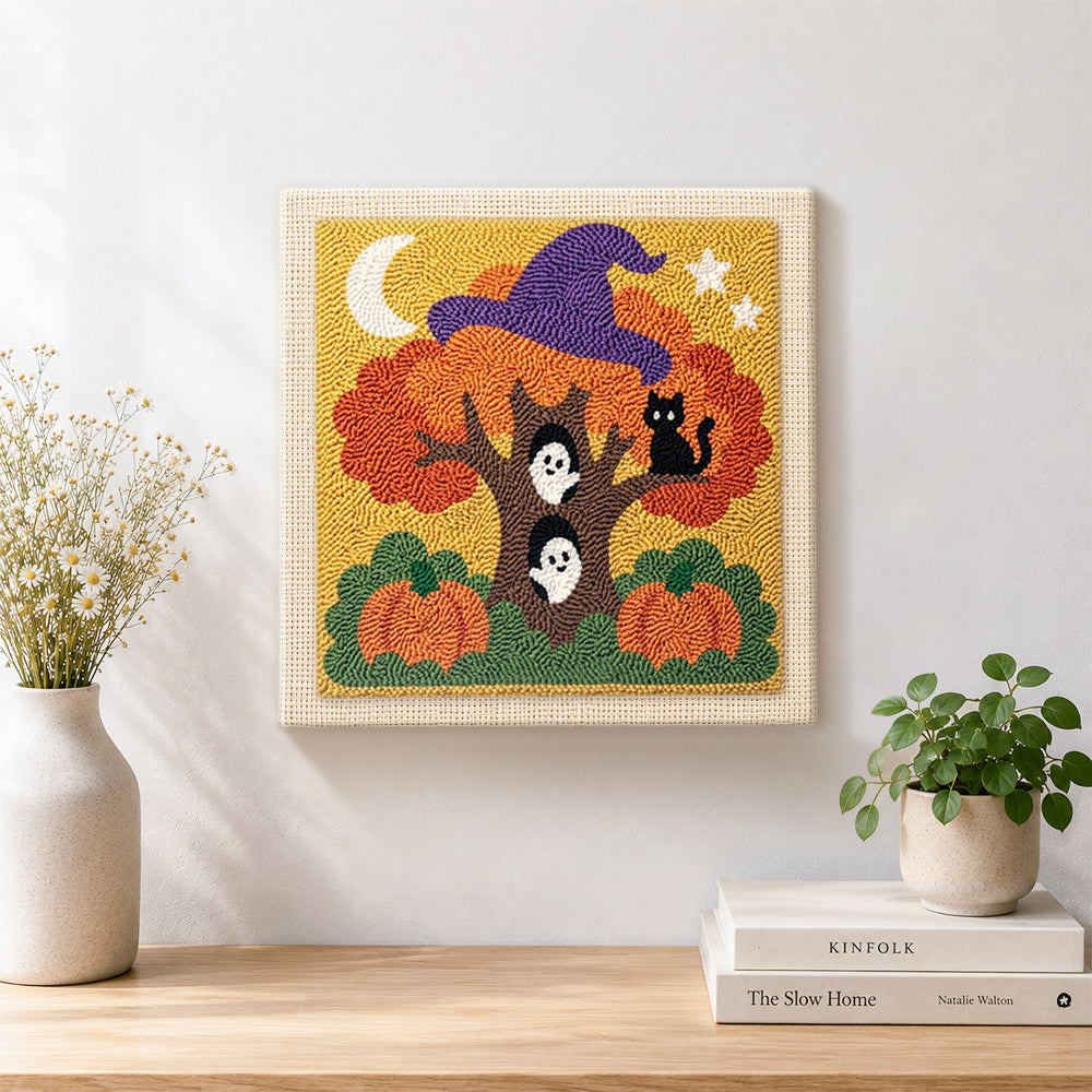 Finished magic halloween tree with ghosts artwork displayed on a wall