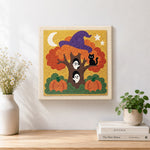 Finished magic halloween tree with ghosts artwork displayed on a wall