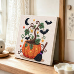 Magic pumpkin pot punch needle artwork displayed on a table