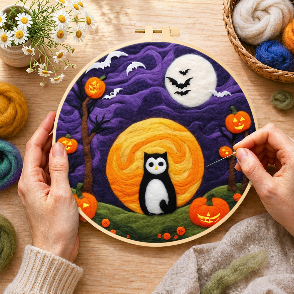 Creating the magical black cat and double moons wool painting by hand with a felting needle
