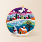 Magical rainbow snowy village at christmas needle felting kit for beginners with a round wooden frame