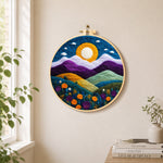 Magnificent mountains and sunset needle felt wall art displayed in a bright home interior