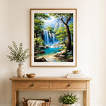 Finished majestic blue waterfall in forest canyon cross stitch artwork displayed as home decor