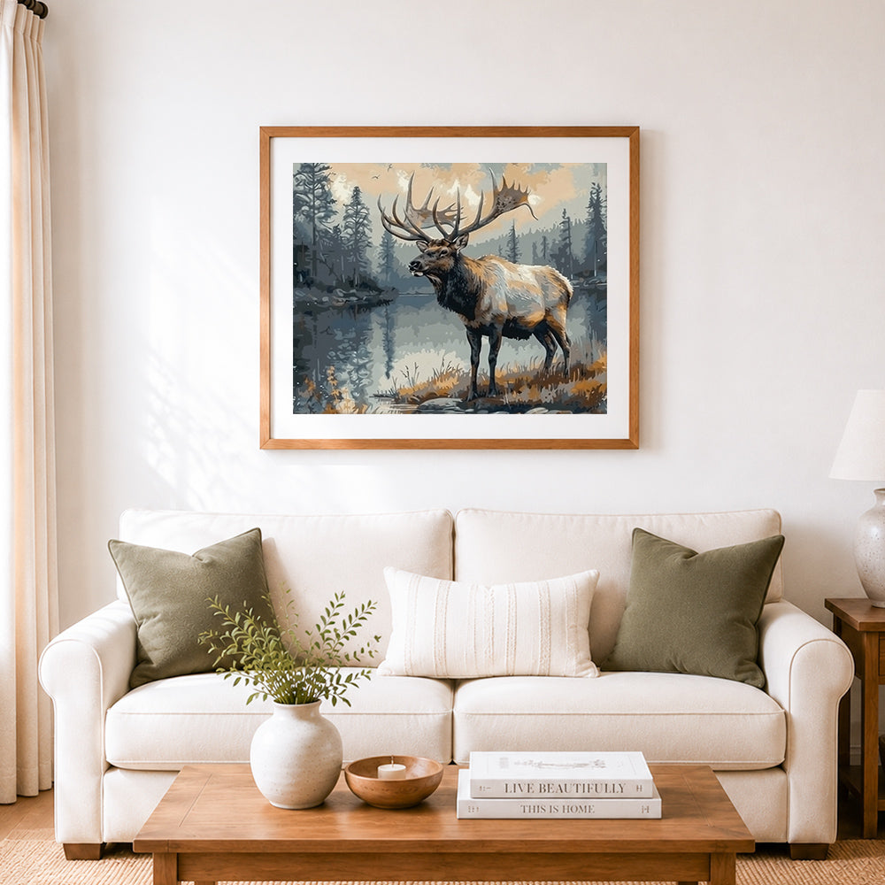 Finished majestic bull elk by the lake cross stitch artwork displayed as home decor