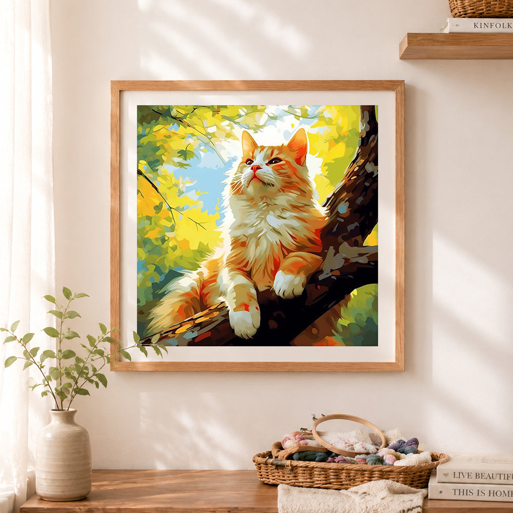 Finished majestic ginger cat on sunlit branch cross stitch artwork displayed as home decor