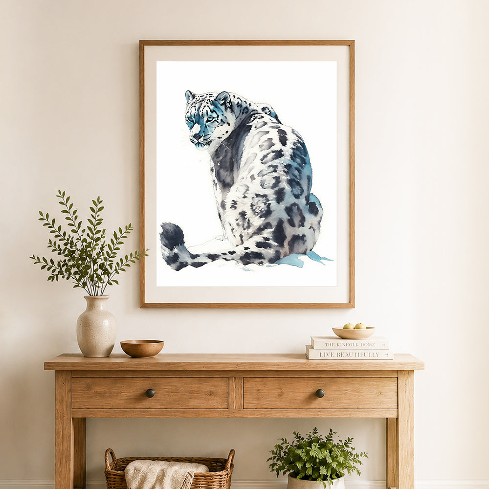 Finished majestic snow leopard cross stitch artwork displayed as home decor