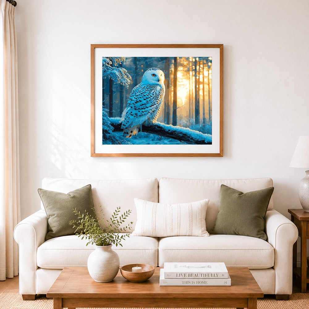 Finished majestic snowy owl in golden winter forest cross stitch artwork displayed as home decor