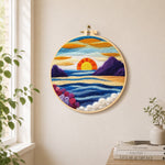 Majestic sunset and blue wavy sea needle felt wall art displayed in a bright home interior