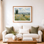 Finished man in hat walking through flower field cross stitch artwork displayed as home decor