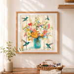 Finished mason jar flowers and hummingbirds cross stitch artwork displayed as home decor