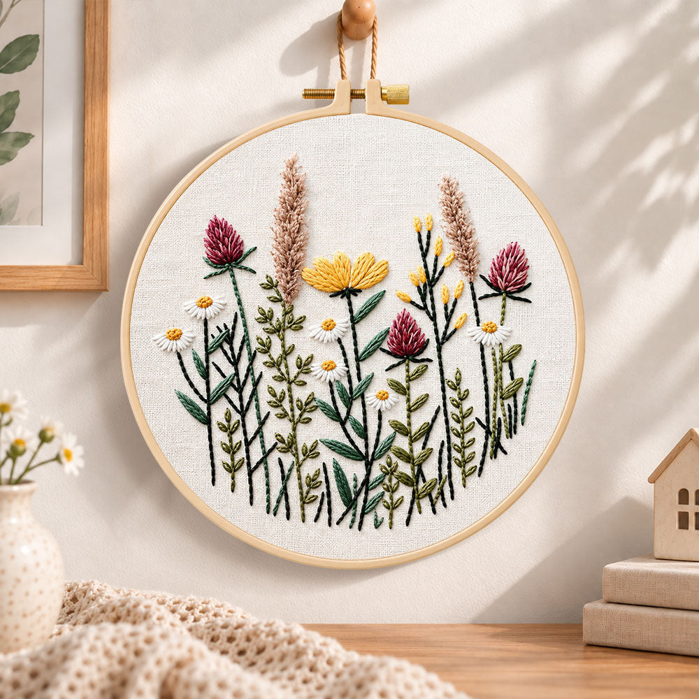 Meadow blossom embroidery hoop wall art displayed as warm and cozy handmade home decor