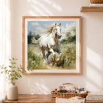 Finished meadow white galloping horse cross stitch artwork displayed as home decor