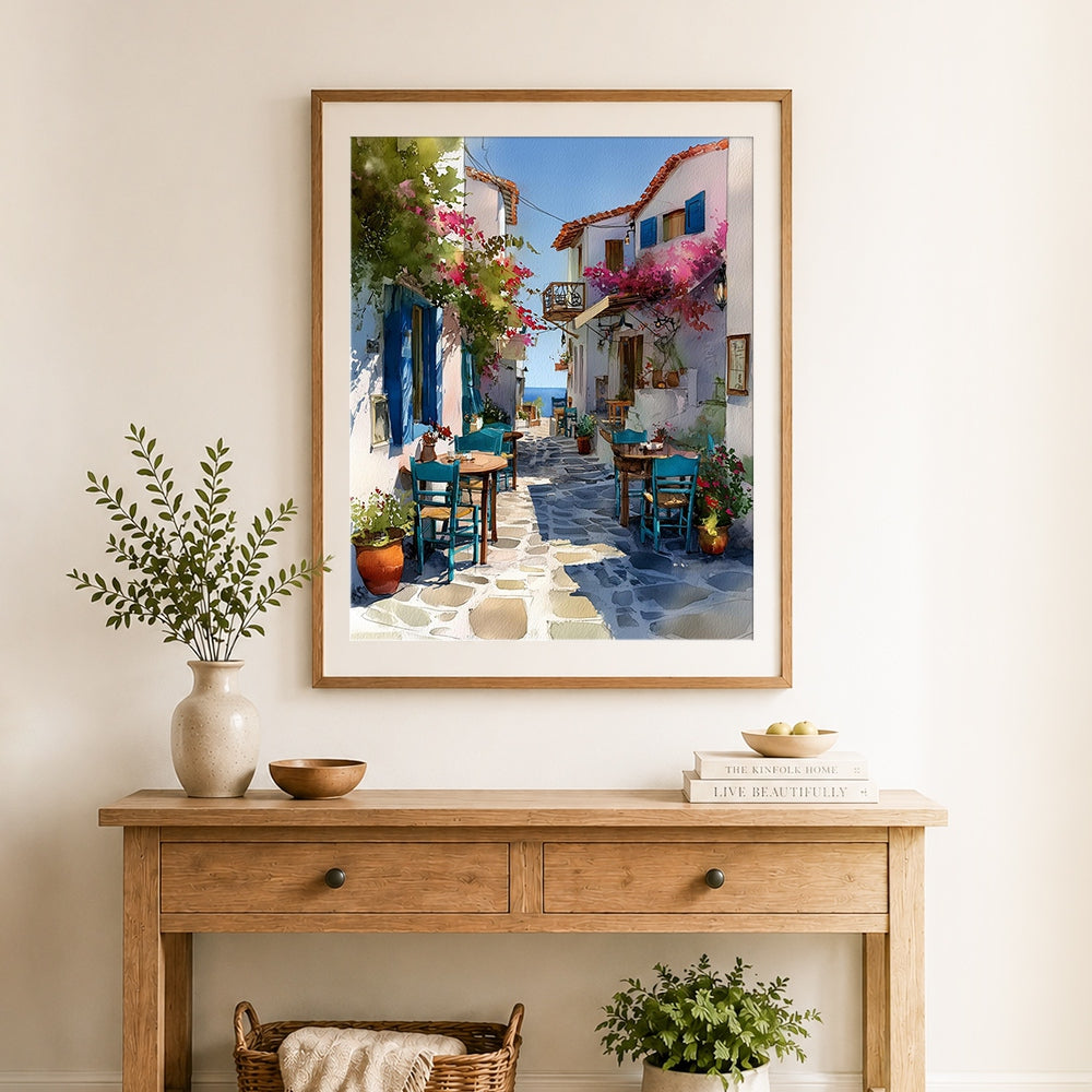 Finished mediterranean white alley with bougainvillea cross stitch artwork displayed as home decor