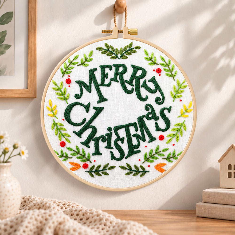 Merry christmas wreath embroidery hoop wall art displayed as warm and cozy handmade home decor