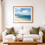 Finished minimalist teal ocean and white clouds cross stitch artwork displayed as home decor