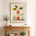 Finished minimalist vase still life cross stitch artwork displayed as home decor