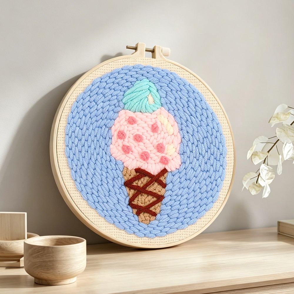Mint and pink scoop ice cream punch needle artwork displayed on a table