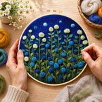 Creating the mint green and blue roses at night wool painting by hand with a felting needle