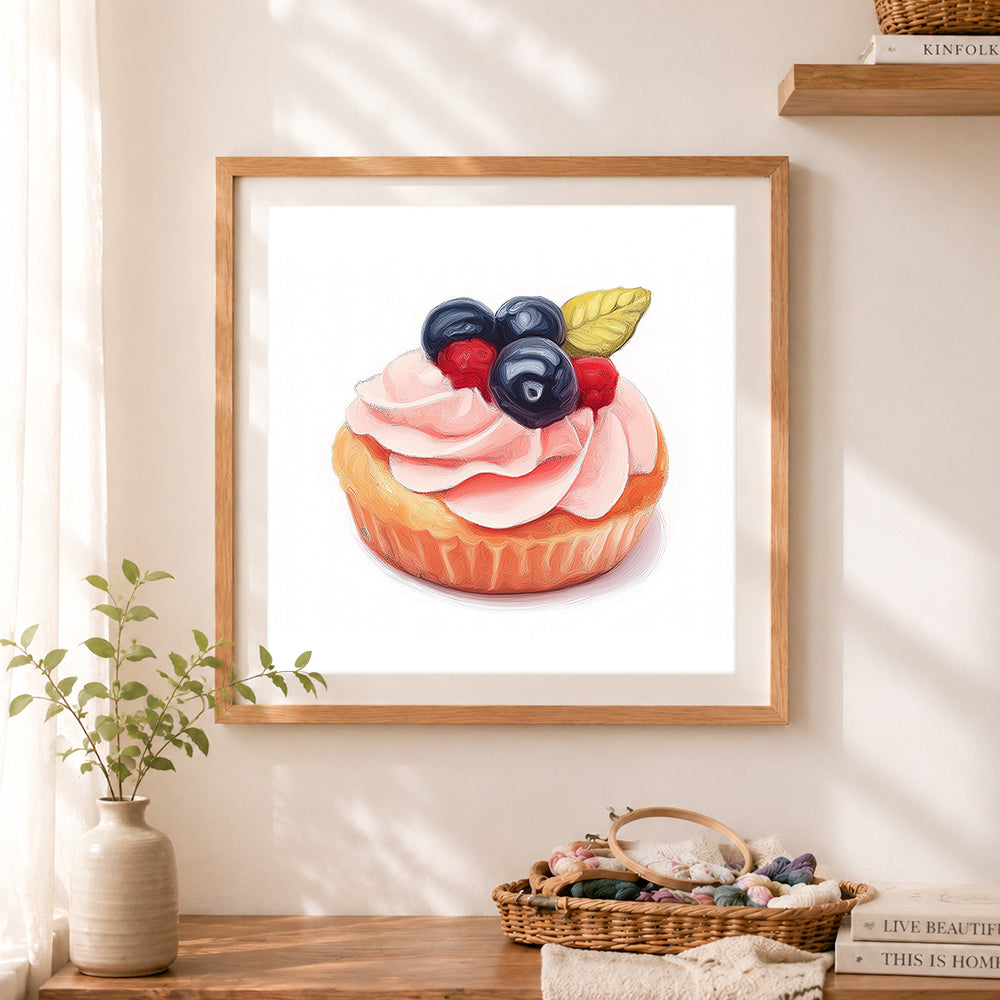 Finished mixed berry cupcake cross stitch artwork displayed as home decor