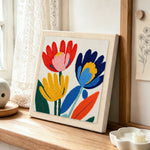 Modern abstract and colorful flowers punch needle artwork displayed on a table