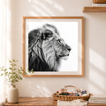 Finished monochrome lion portrait cross stitch artwork displayed as home decor
