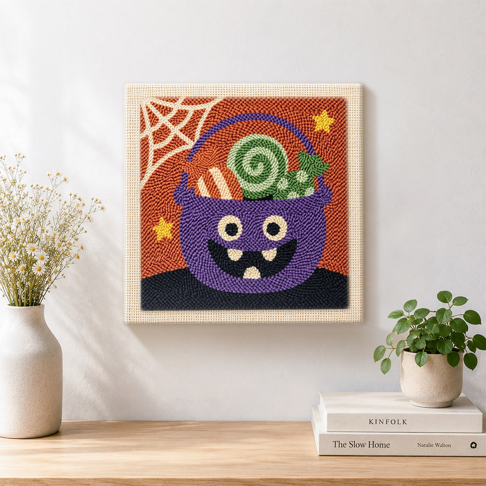 Finished monster candy bucket artwork displayed on a wall