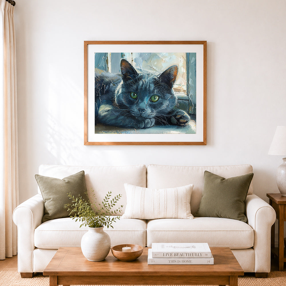 Finished moody black cat cross stitch artwork displayed as home decor