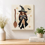 Finished moon witch reading a book artwork displayed on a wall