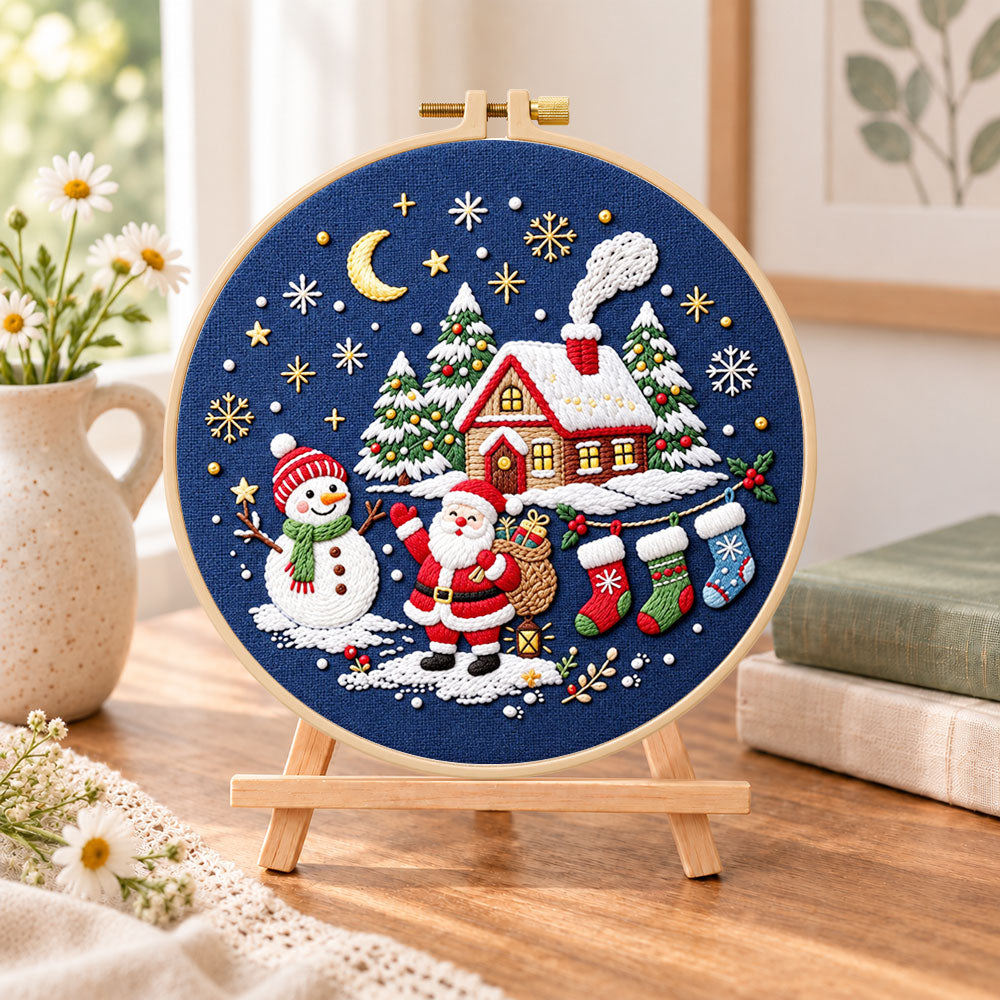 Moonlight christmas scene embroidery kit finished hoop displayed on a wooden stand as cozy tabletop decor