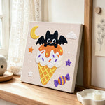 Moonlit bat ice cream punch needle artwork displayed on a table