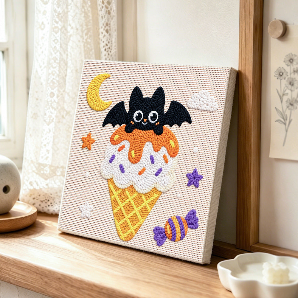Moonlit bat ice cream punch needle artwork displayed on a table