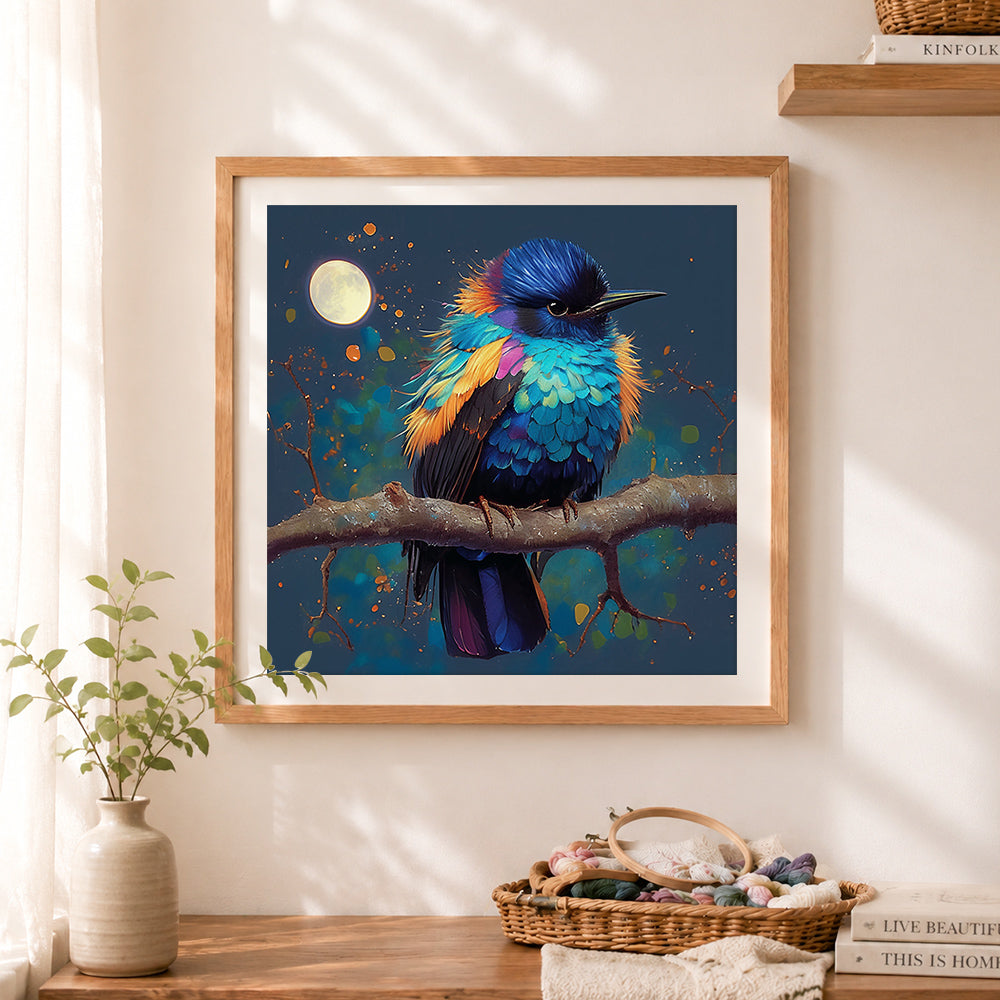 Finished moonlit blue bird cross stitch artwork displayed as home decor