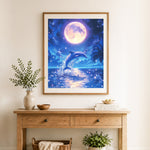 Finished moonlit dolphin leap cross stitch artwork displayed as home decor