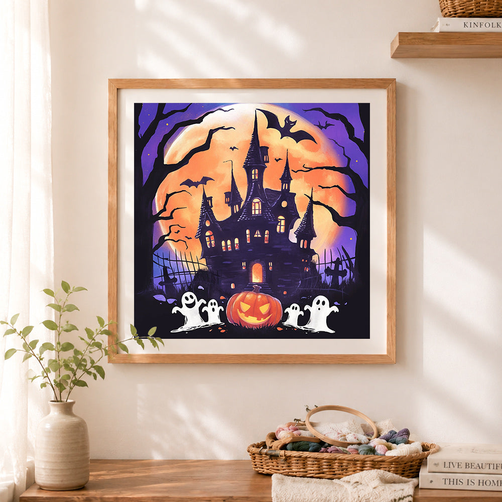 Finished moonlit haunted castle cross stitch artwork displayed as home decor