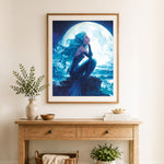 Finished moonlit mermaid on seaside rocks cross stitch artwork displayed as home decor