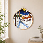 Moonlit snowy cabin with warm glow needle felt wall art displayed in a bright home interior