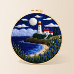 Moonlit white lighthouse and blue roses needle felting kit for beginners with a round wooden frame